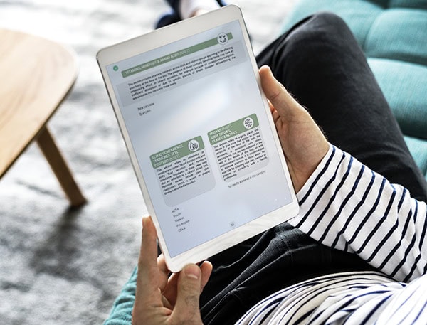 Person reading a Sensitivity and Allergy test report from Testintolerance.com on their tablet.